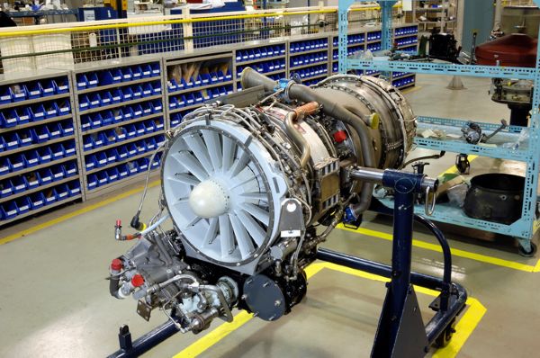 Aerospace jet engine on a maintenance stand in a precision manufacturing facility where aerospace spacers are used